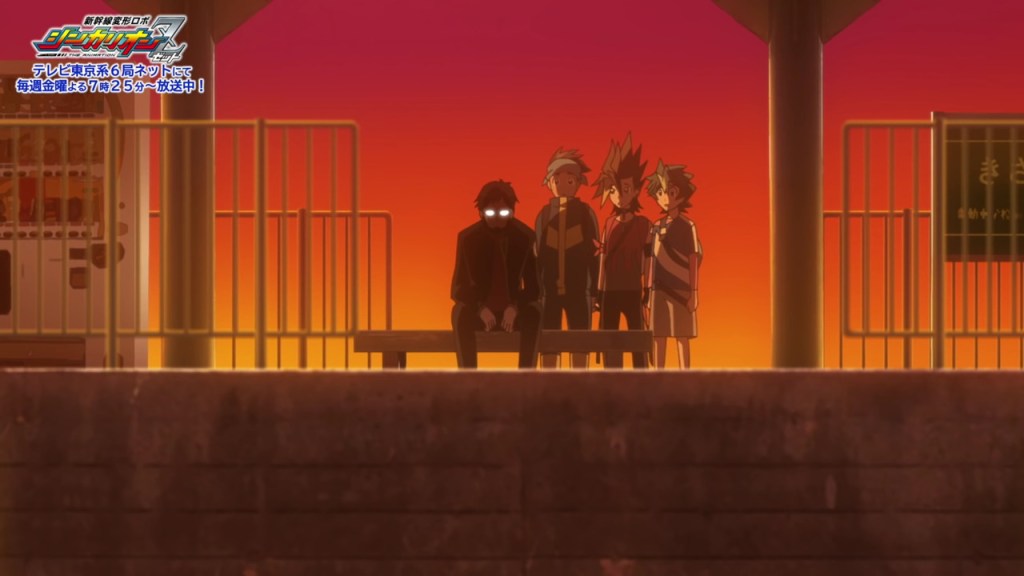 Gendo sitting on a train platform bench next to some Shinkalion Z characters. The background is red and eerie, and Gendo's signature glasses are reflecting light.