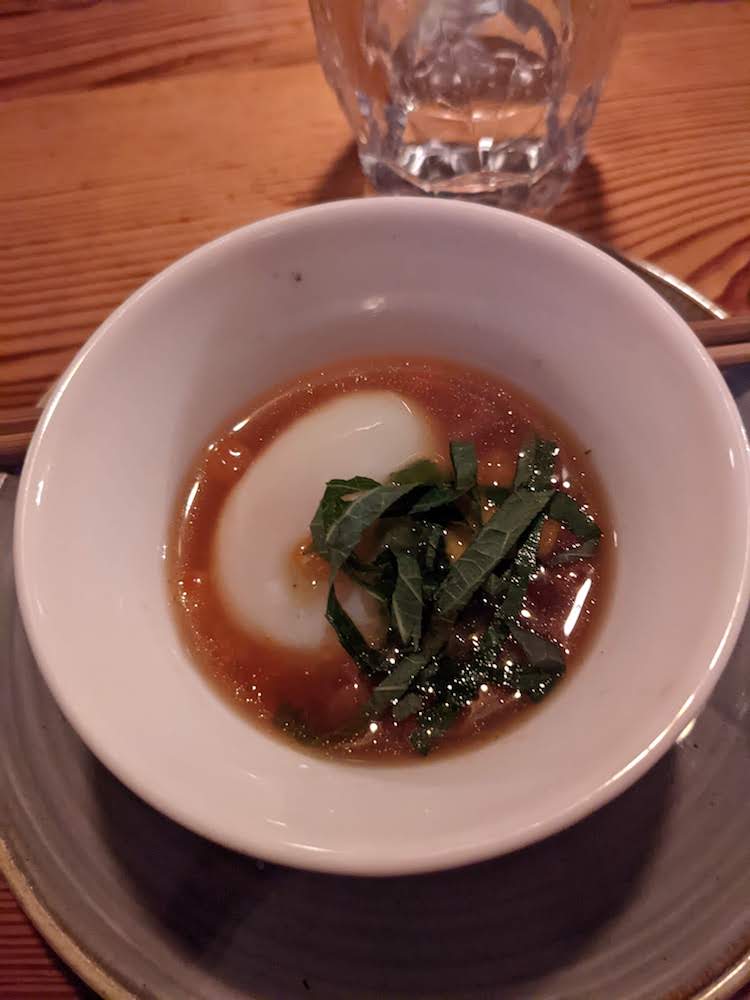 A dish consisting of egg, sea urchin roe, and salmon roe.