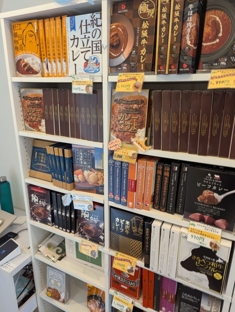 A shelf full of prepackaged curry.