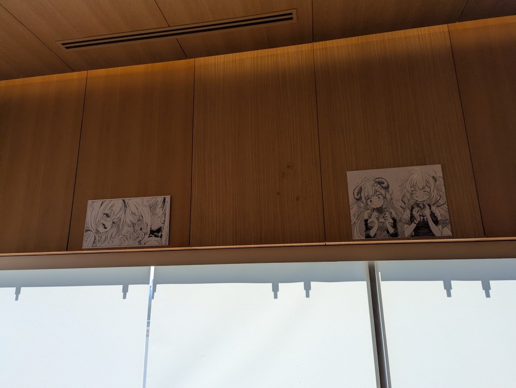 Decorative images of other manga panels.
