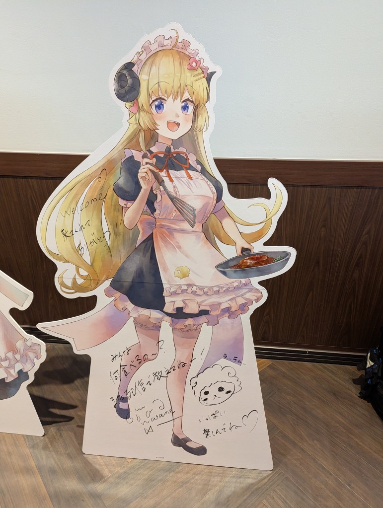 Watame standee.